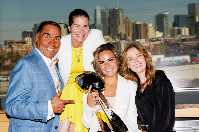 Dr. Rick Perea with event guests and the Lombardi Trophy